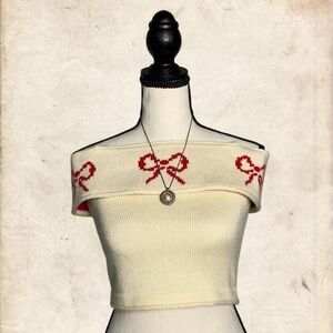 Cream Off-Shoulder Knit Top with Red Bow Design